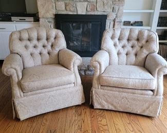 Pair of beige and white upholstered chairs, swivel and rock. 34" high x 36" wide x 28" deep