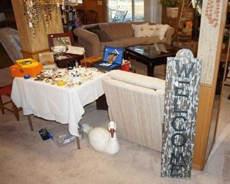 Welcome sign, costume jewelry, cuff links, decoy swan, jewelry box, recliner