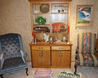 Wooden hutch/bookcase, armchair, rugs, wall art