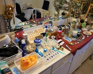 rubber duckie, toiletries, tweezers, scissors, grooming, neck brace, bathroom decor, candles, toothbrush, gauze, ear care, pill box, razor