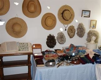 straw hats, ladies wigs, vintage Dolly Parton-era wig, vintage brocade wig stand and carrying case, ladies belts, wood dictionary/book stand, ladies lingerie, scarves