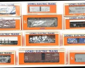 CURRENT OFFER: $170   LOT 14: 12 Lionel freight cars
Description: Twelve freight cars include 16441 New York Central hopper, 17009 New York Central hopper, 9228 Canadian Pacific operating boxcar, 19603 GATX tank car, 16932 Erie flat with rails, 52096 snow village boxcar, two 52090 LCCA Pere Marquette boxcars, 17204 Missouri Pacific boxcar, 17109 Norfolk and Western hopper, 6209 New York Central gondola, and 17515 Norfolk Southern flat with tractors. Trains are generally C8, a few original boxes have light moisture damage.
