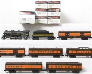 CURRENT OFFER: $200   LOT 17: Lionel 18620 Illinois Central 2-6-2 with nine passenger cars
Description: Lionel modern O gauge 18620 Illinois Central 2-6-2 steam locomotive and tender, 16042 baggage 16043 combo, 16044 passenger, 16045 vista dome, 16046 passenger and 16047 observation in original boxes. Trains are generally C7-8 with run time. OBs have light corner and edge wear.
