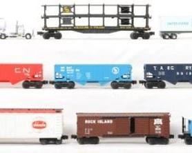 CURRENT OFFER: $220   LOT 19: 31 Lionel freight cars
Description: Thirty one cars include the following numbers 16000, 16001, 16003, 16267, 9042, 9042, 9211, 9740, 9782, 9180, 9011, 19232, 9737, 9064, 9060, 9068, 19536, 16379, 9013, 9172, 9020, 9749, 9250, 9123, 16569, 9825, 9090, Soo Line flat, 9012, and 9078. Also includes two tractor trailers. This is a General Condition lot meaning we have not graded or examined every item in the lot so the condition will typically vary from C6-7 with the possibility of an item or two in the lot having a lower or higher grade, General Condition.