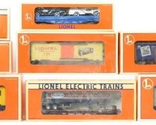 CURRENT OFFER: $150   LOT 21: 8 Lionel cars Eastwood, Hell Gate Bridge, etc 29294, 39200, 52083, etc  
Description: Lionel modern O gauge freight cars in original boxes. Eight cars include 16985 Eastwood flat with Ford panel trucks, 52044 Eastwood vat car, 52083 Eastwood chemical tanker on flat, 52130 Eastwood flat with Hotwheels tanker, 26214 Celebrate the Century stamp boxcar, 26239 MADD boxcar, 39200 and 29294 Hell Gate bridge boxcars. Cars are generally C8 however have dust from display. OBs have light corner and edge wear.