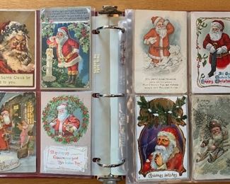 Large notebook filled with antique Christmas post cards.