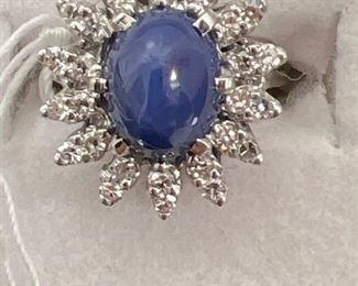 14 K white gold with blue star sapphire with diamonds ring 
