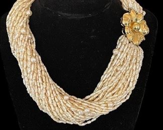 Spectacular 40 Strand Rice Pearl Necklace.  Contains 40 6m/m cultured pearls and 80 18k yellow gold rondells.  Clasp is 18k gold - 38 m/m diameter.