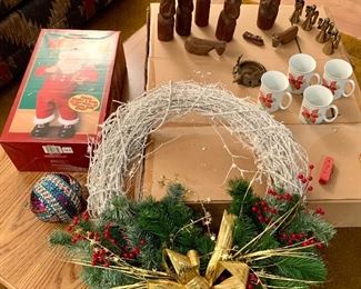 Jingle Bell Rock Santa $18
Wreath $18, 
4 poinsettia mugs set $5sold