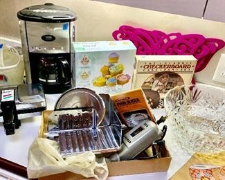 Rival Electric Food Slicer $39
Pizzelle Maker $60 
Be Coffee maker $15
Cupcake stand $6
Checker cake mold $5
Glass Punch Bowl 2 available $8 ea
Pink Butterfly placemats 2 for 1.00
