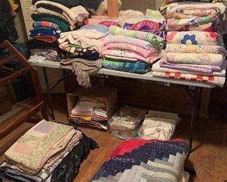 Quilts, blankets, vintage tablecloths and napkins.