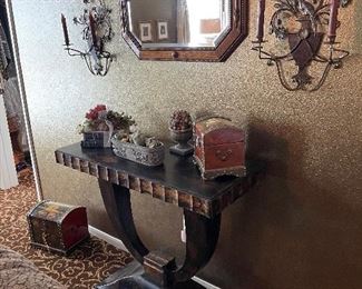 Hall table, mirror and sconces with upscale décor items to match