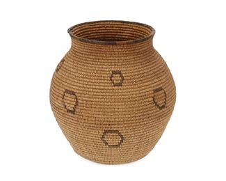 5003
A Chemehuevi Basket
First-Quarter 20th Century
An olla form basket with scattered circular motifs
7" H x 6.5" Dia.
Estimate: $800 - $1,200