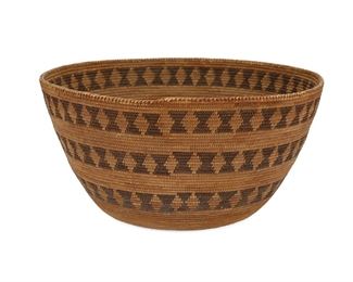 5010
A Western Mono Basket
First-Quarter 20th Century
The basketry bowl woven with three bands circling the body and repeating lozenge motif
10.25" H x 5.25" Dia.
Estimate: $800 - $1,200