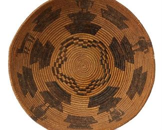 5009
A Havasupai Pictorial Basket
First-Quarter 20th Century; Western Arizona
The woven basketry tray with four figures and a horse atop geometric motifs centering a star
4" H x 13.5" Dia.
Estimate: $800 - $1,200