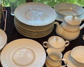 Large place setting plus serving pieces of Noritake China with gold trim