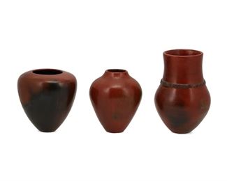 6058
Three Alice Cling Navajo Redware Pottery Vessels
(b. 1946, Diné)
Each signed: Alice Cling
Each with burnished slip glaze, one with an incised banded waist, 3 pieces
Largest: 7" H x 5" Dia.; Smallest: 5" H x 5" Dia.
Estimate: $300 - $500
