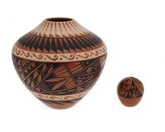 6062
Two Jemez Pueblo Pottery Vessels
Two works:

A Geraldine Sandia vessel
(b. 1950, Jemez Pueblo)
Signed: G. Sandia / Jemez
The wide shouldered vessel with polychrome geometric motifs on a red burnished slip glaze
8.5" H x 9" Dia.

A small seed pot
20th Century
Signed: J.F. Toya / Jemez [possibly for John Fitzgerald Toya]
The redware seed pot with geometric, butterfly, and corn stalk motifs on a red burnished slip glaze
2.75" H x 2.5" Dia.

2 pieces
Estimate: $300 - $500
