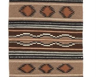 6067
A Navajo Rug, By Pat Yellowhorse
20th Century, Diné
Woven in dark brown, light brown, tan, cream, and grey wool with banded motif
37" L x 21" W
Estimate: $200 - $300