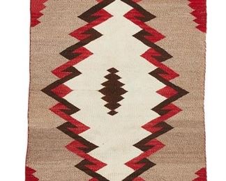 6073
A Navajo Regional Rug
20th Century, Diné
Woven in light brown, dark brown, red, and cream wool centering a serrated diamond with banded edges
49.5" L x 28.5" W
Estimate: $300 - $500