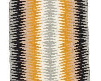 6074
A Navajo Regional Rug
20th Century, Diné
Woven in light grey, black, light brown, yellow, and cream wool with serrated bands
49.5" L x 31" W
Estimate: $400 - $600