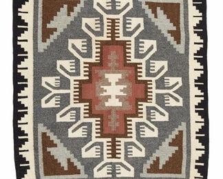 6079
A Navajo Two Grey Hills Textile Mat
Fourth-Quarter 20th Century, Diné
Woven in black, dark grey, light grey, cream, dark brown, and light brown wool with four corner elements and central diamond
28" H x 33.25" W
Estimate: $300 - $500