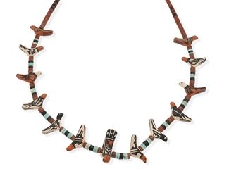 6095
A Robert Tenorio Ceramic Bird Necklace
Fourth-Quarter 20th Century, (B 1950, Santo Domingo/Kewa)
Signed: Robert Tenorio
Hand painted ceramic bird and multistone bead necklace with silver tips and hook and chain fastening
27 - 31" L x 2" H
84.5 grams
Estimate: $400 - $600