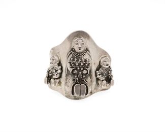 6103
A Cochiti-Style Storyteller Cuff Bracelet
Fourth-Quarter 20th Century
Stamped: 925
A silver cuff similar in design to works by Carol Felley, featuring three applied silver seated female storytellers with laps full of children
6.375" total inner C x 2.75" H, wrist opening: 0.5"
80.7 grams
Estimate: $300 - $500