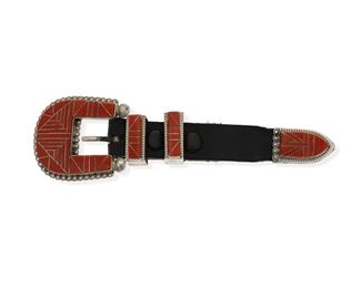 6139
A Donald & Viola Eriacho Zuni Silver Inlay Buckle Set
Late 20th/Early 21st Century
Stamped: D-V Erriacho / Sterling
The four piece Ranger Buckle set is inlaid with spiney oyster and includes a buckle, two belt loops and a tip

4 pieces
Buckle: 1.75" H x 2.125" W; Each loop: 0.875" H x 0.375" W; Tip: 1.25" L x 0.75" H; As mounted on leather strap: 6.25" L
61.6 grams
Estimate: $300 - $500