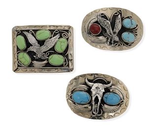 6143
A Group Of Southwest Belt Buckles
Fourth-Quarter 20th Century or Later
Each stamped: SS / Hecho en Mexico
Three works:

An oval buckle with a centered steer skull and two bezel set turquoise stones
2.5" H x 3.75" W

An oval buckle with a centered eagle in flight and bezel set turquoise and coral stones
2.5" H x 3,75" W

A rectangular buckle with a centered eagle surrounded by five bezel set green stones
2.75" H x 3.75" W

3 pieces
174 grams gross
Estimate: $400 - $600