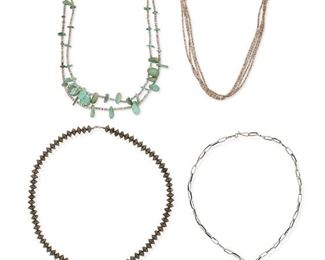 6151
A Group Of Southwest Jewelry
Mid-20th Century or Earlier
Each appears unmarked
Four works:

A Pueblo turquoise tab and heishi shell double strand necklace
26" L

A four strand heishi shell necklace
27" L (adjustable)

A sandcast Yei pendant on a paperclip chain
26.5" L x 3.5" H

A teardrop three stone pendant with stamped metal bead chain
32" L x 2.75" H

4 pieces
294.8 grams gross
Estimate: $500 - $700