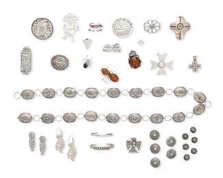 6172
A Group Of Southwest-Style Jewelry Items
Mid-20th/Early 21st Century
Thirty-five works:

A small concho belt with stone set turquoise and stampwork accents
Appears unmarked
37" L x 1" H

A round incised silver buckle with Zuni-style bear motif
Stamped: GB [possibly for George Begay, Diné] / Sterling
2" Dia.

A silver overlay pendant with satin cord
Stamped: Lancer / [mountain symbol] / © ; Further etched: 7/7
2.25" H x 2" W

An engraved silver openwork filigree pendant / bolo
Stamped: Fleming / Sterling / Mex. / [central symbol] / Eagle 214
2" Dia.

A small silver cross with stamped design
Stamped: Mexico / 925 / TM-90
1.5" H x 1.125" W

A large ring with two stones framed with elaborate feather and floral motifs all mounted on a silver Claddagh ring base
Marked with an Illegible signature; Further stamped: 925
Ring size: 7.5; 1.75 ' L

A Kachina dancer silver brooch
Stamped: Douglas Etsitty [Diné] / Sterling / ©
2.75" H x 1.5" W

A cast silver icon brooch
Etched illegibly, possib
