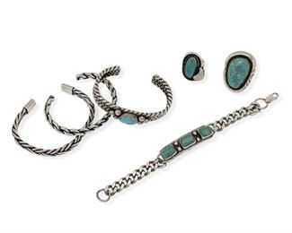6178
A Group Of Southwest Jewelry
Late 20th/Early 21st Century
Six works:

A narrow four rope chunky wire silver cuff bracelet with stone set turquoise
Stamped: unknown, MPM [multiple triangles] / Sterling
6" total inner C x 0.5" H, wrist opening: 1"

A chunky braided wire cuff silver bracelet
Stamped: 925
6.5" total inner C x 0.375" H, wrist opening: 1"

A Navajo three wire braided silver cuff
Stamped: R [for Roy Buck, Diné] / Sterling
6.125" total inner C x 0.25" H, wrist opening: 1"

A chain link clasp bracelet with a bezel set turquoise plaque
Appears unmarked
7" L x 0.5" H

A Navajo shadowbox bezel set silver and turquoise ring
Stamped: G.O.Bennett [for George O Bennett, Diné]
Ring size: 7.5; 1.5" L x 1" W

A shadowbox set turquoise ring with feather accent
Appears unmarked
Ring size: 4.25

6 pieces
165.8 grams
Estimate: $300 - $500