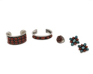 6180
A Group Of Southwest Jewelry
Late 20th/Early 21st Century
Four works:

A cluster set coral cuff bracelet
Appears unmarked
6" total inner C x 1.25" H, wrist opening: 1"

A cluster set coral ring
Appears unmarked
Ring size: 6.5

A Noah Pfeffer bezel set spiny oyster narrow cuff bracelet
Stamped: Noah [for Noah Pfeffer, Anglo] / Sterling
6.5" total inner C x 0.625" H, wrist opening: 1.125"

A pair of Navajo cluster set turquoise and spiny oyster clip earrings
Each stamped: RD [possibly for Rose Draper, Diné] / Sterling
1.375" L x 1.25" W

5 pieces
117.6 grams gross
Estimate: $400 - $600