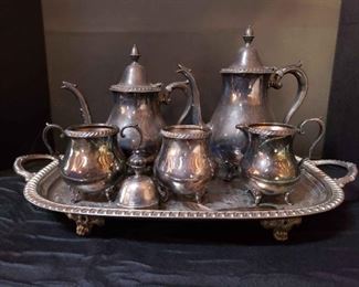https://ctbids.com/estate-sale/13112/item/1131306 Wallace Silverplated Tea Set & More
Wallace silverplated pieces, Queen Anne silverplated spoon, and large silverplated tray. One lid may not be Wallace, but it fits on a piece. Tray does have an inscription on it. Tray measures approximately 22" x 12" including handles. The lighting/reflections are making it difficult to photograph the markings. They are stamped Wallace M6 01F and has the W logo over Wallace, Wallace Silverplate 1601, Wallace 601F, and Wallace 1100.