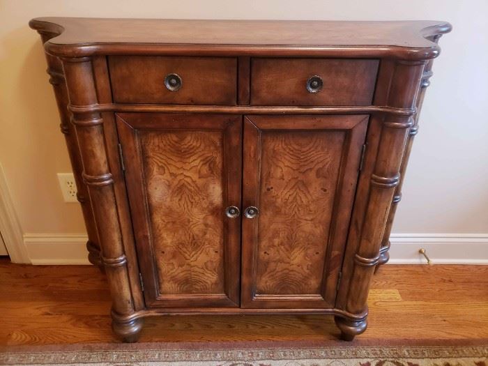 https://ctbids.com/estate-sale/13112/item/1187465 Gorgeous Burlwood Entry Table
This distinctive piece is a wonderful example of burlwood. Intricate detail and curved sides. This cabinet measures 36.5" tall, 45.5" at it's widest width, 32" width in the front and 15.5" in depth.
