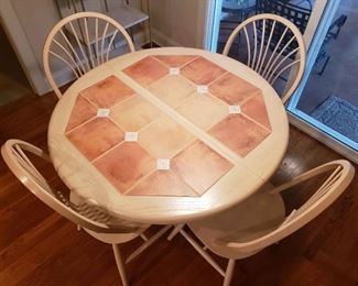 https://ctbids.com/estate-sale/13112/item/1187524 Tiled Top Dining Table W/ Four Chairs & Leaf
This is a wonderful table with peach/salmon colors with beautiful floral diamonds featured. There is a leaf that turns this table into an oval sized shaped. The table in its current size measures approximately 42.5" in width and 30.5" in height. The 4 chairs measure 38" in height from the floor to the back of the chair and sear width is 18.5". The leaf adds on another 16" in length. 