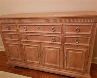 https://ctbids.com/estate-sale/13112/item/1187992 Stanley Furniture Buffet
This Stanley Furniture buffet is a statement piece for your dining room. It has dovetail joints, brass fixtures, and a felt flatware organizer/display in center top drawer. It measures 61.6" in length, 19" deep, and 40.5" in height. 