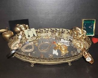 https://ctbids.com/estate-sale/13112/item/1216354 Ladies' Collection: Sterling Silver, Watches, & More
Collection of ladies' jewelry including sterling silver, watches, mirrors, pins, vanity tray, and more. Approximately 31 grams of sterling silver. 