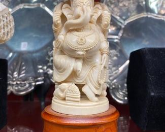 Left trunk Ganesh in carved ivory  6 1/2" tall with stand