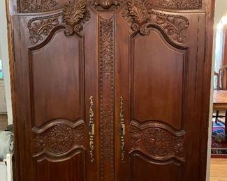 Stunning carved antique armoire