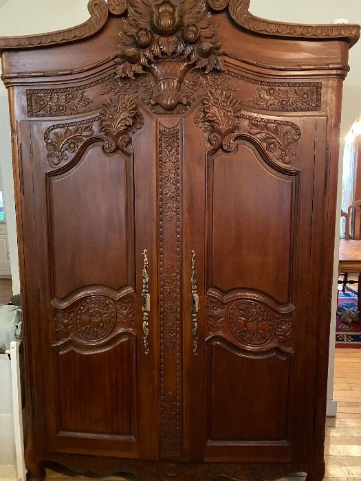 Stunning carved antique armoire