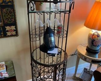 Nice wine storage, wrought iron with locking cage. 
