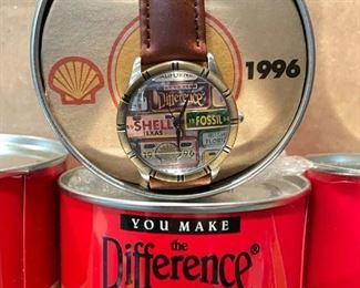 Each can contains a Fossil watch with Shell insignia