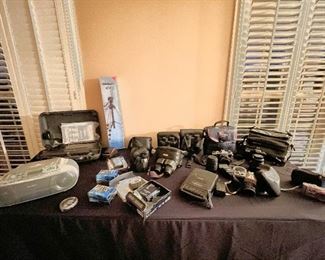 Variety of vintage cameras and other electronics. 