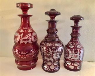 Cranberry Bohemian etched decanters.  $85 - Left: 10" H. $75 - Center: 9.5" H. $65 - Right: 8.5" H-SOLD. 
