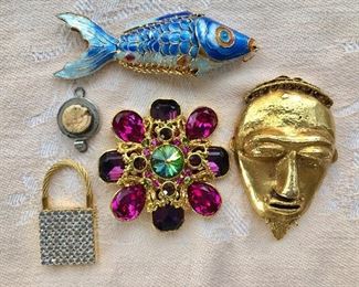 $40 Enamel fish, $20 padlock, $25 Face and $25 clasp. Middle item SOLD 