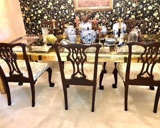 Contemporary brass and glass dining table/Chippendale chairs