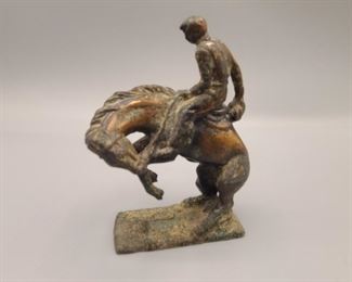 Bronze cowboy on bucking horse statue 