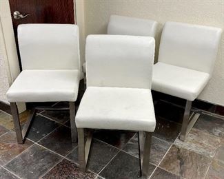 Item 59:  (4) White leather chairs with chrome base - 19.5"l x 17.5"w x 32"h:  $245